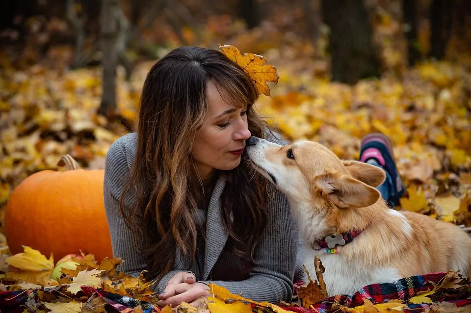 pic 3 woman and dog in leaves