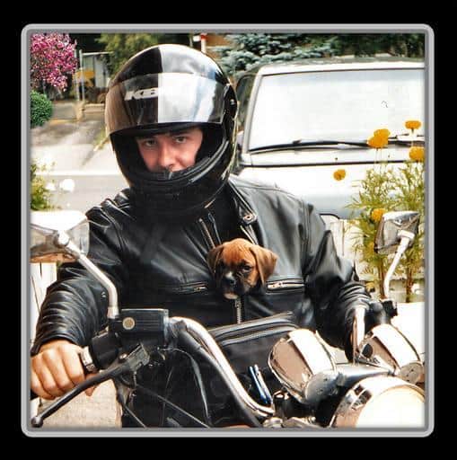 Pic 2 a man with a dog in his leather jacket