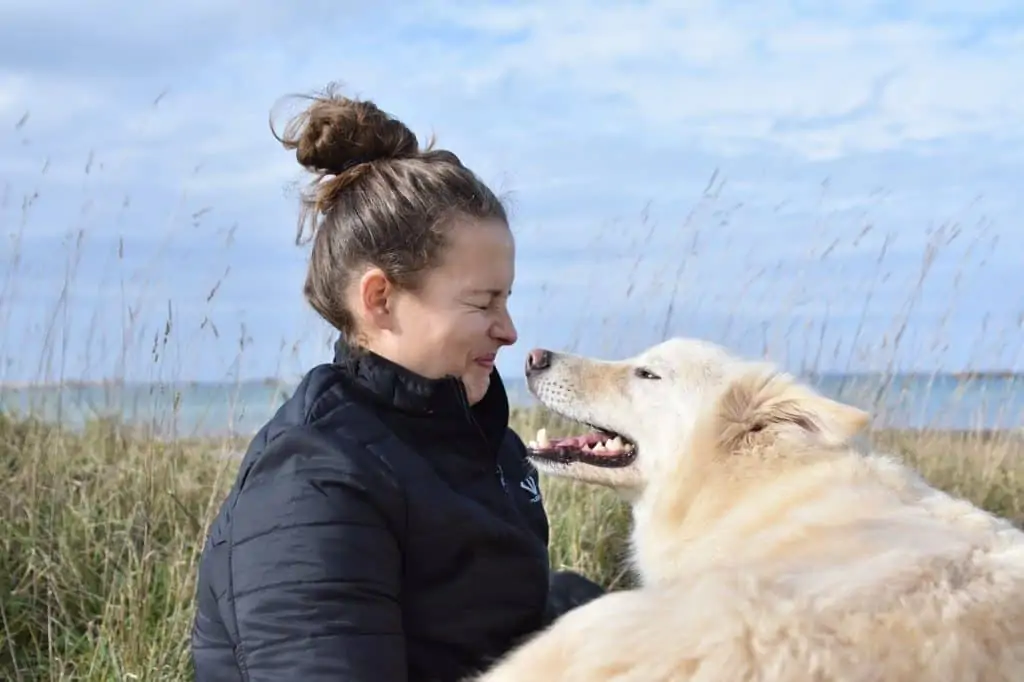 1 a woman with her golden retriever outside