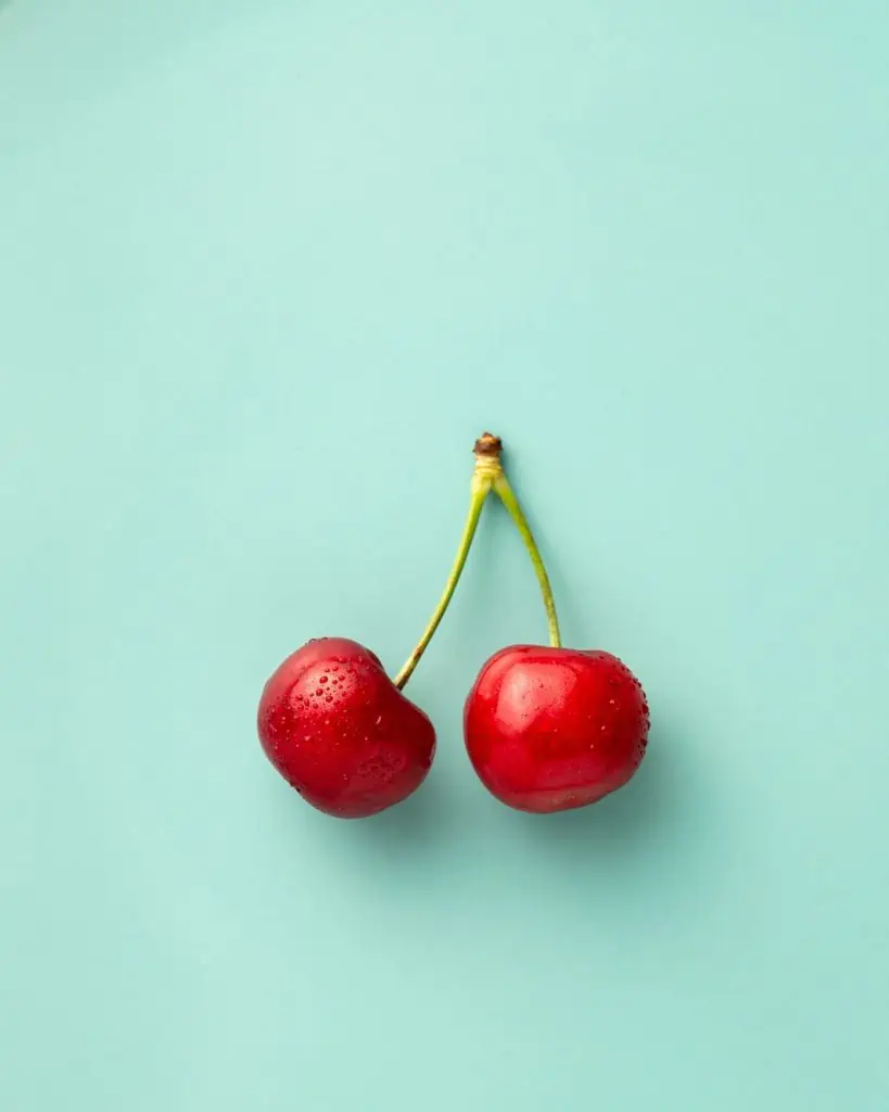 7 cherries against blue